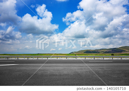 Open road under vibrant sky with no people or vehicles Open road under vibrant sky with no people or vehicles 140105710