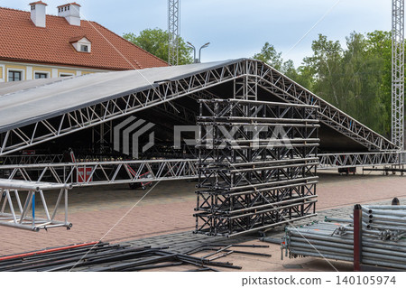 Outdoor concert stage covered with black tarp Outdoor concert stage covered with black tarp 140105974