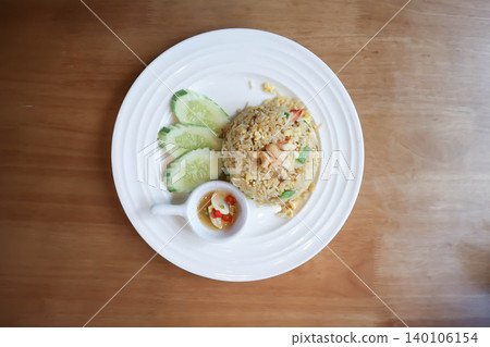 stir fried rice or fried rice with cashew nut topping and cucumber stir fried rice or fried rice with cashew nut topping and cucumber 140106154