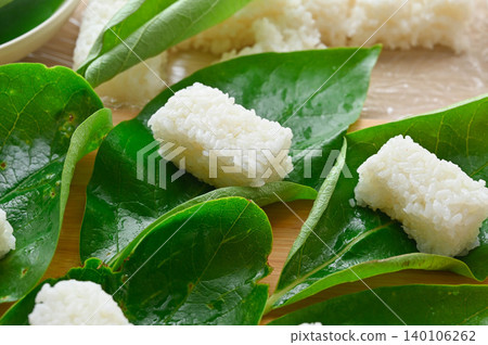Handmade persimmon leaf sushi: A scene of local cuisine being prepared. Handmade persimmon leaf sushi: A scene of local cuisine being prepared. 140106262