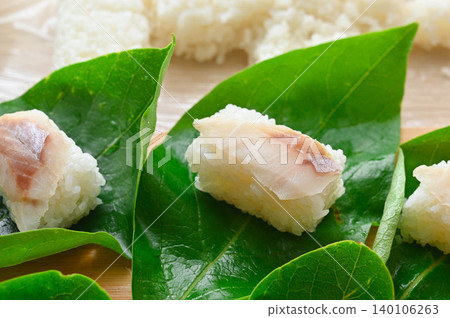 Sushi served on fresh leaves Sushi served on fresh leaves 140106263