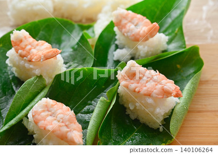 Sushi served on fresh leaves Sushi served on fresh leaves 140106264