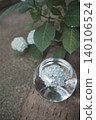 Blue hydrangeas floating in a glass bowl and the scenery of the rainy season. 140106524