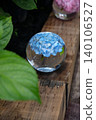Blue hydrangeas floating in a glass bowl and the scenery of the rainy season. 140106527