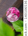 Blue hydrangeas floating in a glass bowl and the scenery of the rainy season. 140106536