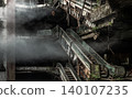 Within a crumbling, multi-tiered atrium, a hauntingly beautiful scene of post-industrial desolation unfolds in an eerie, poetic stillness. Thick plumes of spectral smoke drift like ghosts through a 140107235