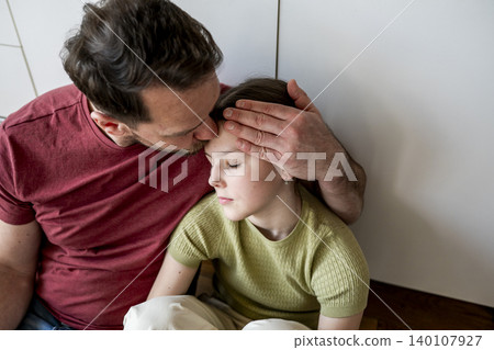 Parent providing mental health support to teenage child facing challenges at home. Parent providing mental health support to teenage child facing challenges at home. 140107927