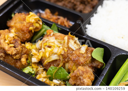 Delicious Chinese bento box with fried chicken in sweet and sour sauce Delicious Chinese bento box with fried chicken in sweet and sour sauce 140109259