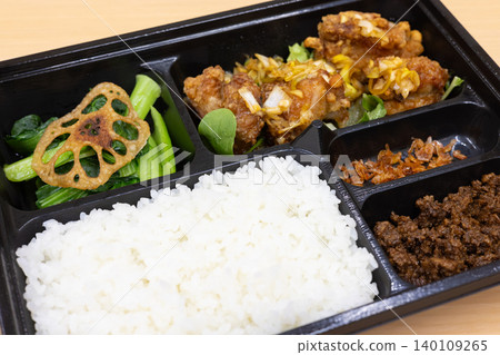 Delicious Chinese bento box with fried chicken in sweet and sour sauce Delicious Chinese bento box with fried chicken in sweet and sour sauce 140109265