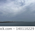 A tranquil seaside landscape with clouds spreading across it. 140110229