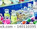 Jars with shiny decorative dyes on exhibition 140110395