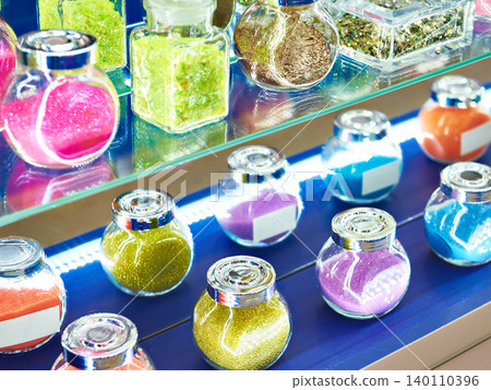 Jars with shiny decorative dyes on exhibition Jars with shiny decorative dyes on exhibition 140110396
