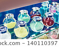 Jars with shiny decorative dyes on exhibition 140110397