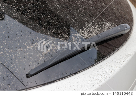A photo of the rear window and wiper covered in volcanic ash from Sakurajima. A photo of the rear window and wiper covered in volcanic ash from Sakurajima. 140110448