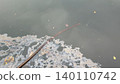 Iridescent oil slick polluting dark water surface 140110742