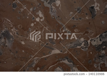 Dark red marble slab with visible veins close up Dark red marble slab with visible veins close up 140110986