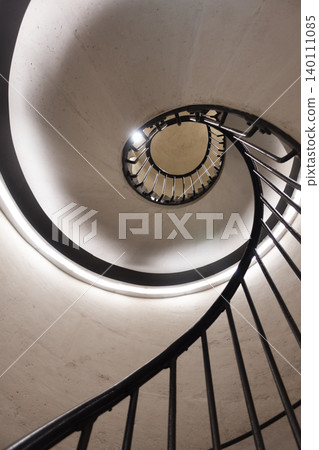 Upward view on spiral stairs Upward view on spiral stairs 140111085