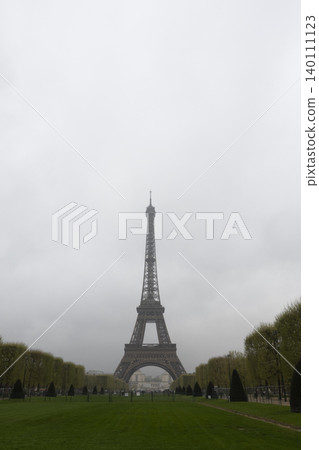 Low visibility view of Eiffel Tower in heavy fog, moody weather in Paris 140111123