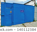 Homemade entrance gate in disadvantaged area of the city 140112384