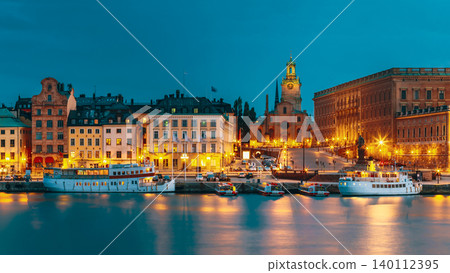 Scenic View Of Embankment In Old Part Of Stockholm At Summer Evening, Sweden. Time After Sunset. Scenic View Of Embankment In Old Part Of Stockholm At Summer Evening, Sweden. Time After Sunset. 140112395