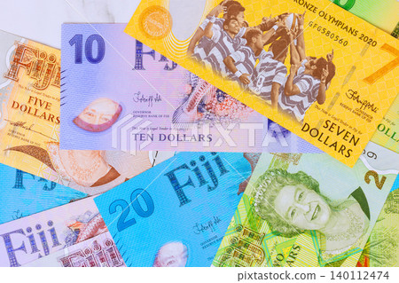 Different money from Fiji dollar cash are placed together banknotes various values. Different money from Fiji dollar cash are placed together banknotes various values. 140112474
