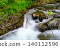 Pure water stream flowing over rocky mountain terrain in the Kakopetria forest,  Troodos, Cyprus 140112596