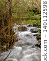 Pure water stream flowing over rocky mountain terrain in the Kakopetria forest,  Troodos, Cyprus 140112598