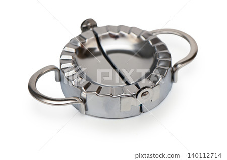 Metal Dumpling and Ravioli Cutter Mold on White Background Metal Dumpling and Ravioli Cutter Mold on White Background 140112714
