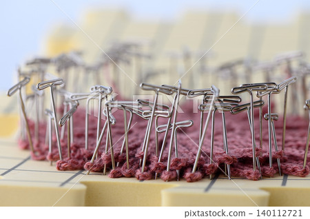 Blocking Knitted Fabric with Pins Process Isolated on White Background Blocking Knitted Fabric with Pins Process Isolated on White Background 140112721