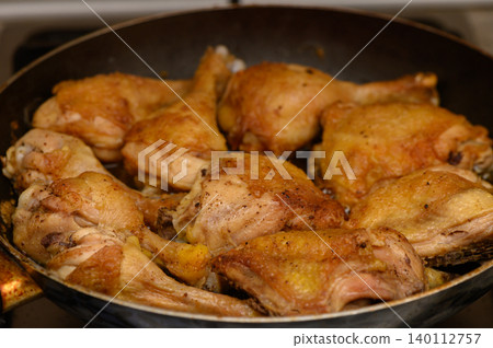 Close-Up of Fried Chicken Drumsticks and Thighs in Pan Close-Up of Fried Chicken Drumsticks and Thighs in Pan 140112757