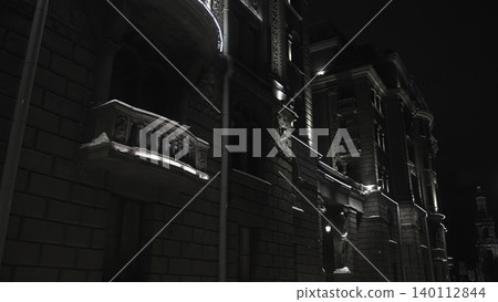 Snowcovered Balustrades And Vertical Cornices Enhance Cinematic Atmosphere Of Illuminated Cityscape. Media 140112844