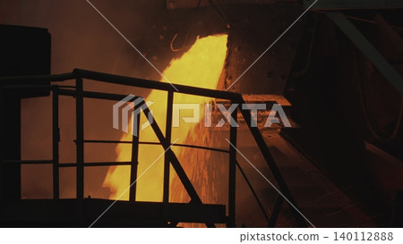 Vivid Orange Molten Liquid Spills And Flows Over Industrial Stairs And Rail Structures With Smoky Background . Stock clip 140112888