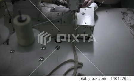 Continuous Sewing Process Of Fabric And Elastic Components Ensuring High Quality Standards. Media Continuous Sewing Process Of Fabric And Elastic Components Ensuring High Quality Standards. Media 140112903