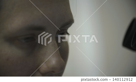 An Individual Woman Carefully Studies Detailed Microscopic Images During Laboratory Data Analysis Process . Stock clip 140112912