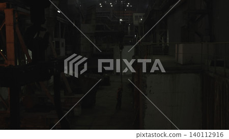 Manufacturing Plant With Machinery. An Atmospheric View Of Factory Interior With Machinery And Lighting . Stock clip Manufacturing Plant With Machinery. An Atmospheric View Of Factory Interior With Machinery And Lighting . Stock clip 140112916