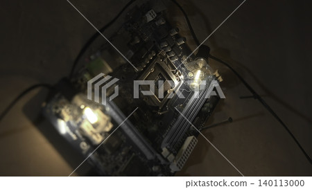Electronics Testing Scene. Inspection Of Circuit Board With Diagnostic Equipment In Dim Workspace. Media Electronics Testing Scene. Inspection Of Circuit Board With Diagnostic Equipment In Dim Workspace. Media 140113000