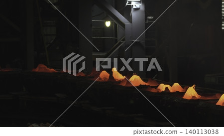 Hot Billets Move Through Factory Cooling. Bright Red Hot Pieces Glide Along Conveyor System . Stock clip Hot Billets Move Through Factory Cooling. Bright Red Hot Pieces Glide Along Conveyor System . Stock clip 140113038