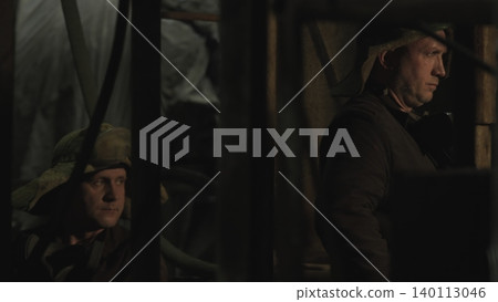 Engineers And Apprentice Scrutinize Corroded Piping Amidst Atmospheric Industrial Lighting And Tension . Stock clip Engineers And Apprentice Scrutinize Corroded Piping Amidst Atmospheric Industrial Lighting And Tension . Stock clip 140113046