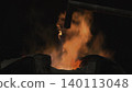 Bright Sparks Fly From Heated Metal. High Temperature Environment With Glowing Molten Metal And Sparks . Stock clip 140113048