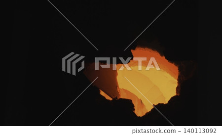 Inspection Of Fiery Core Within Furnace. Bright Orange Glow Emanates From Heated Industrial Chamber . Stock clip Inspection Of Fiery Core Within Furnace. Bright Orange Glow Emanates From Heated Industrial Chamber . Stock clip 140113092