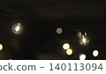 Warm Globe Lights. Serene Cafe Setting Illuminated By Warm String Lights Creating Romantic Atmosphere . Media 140113094