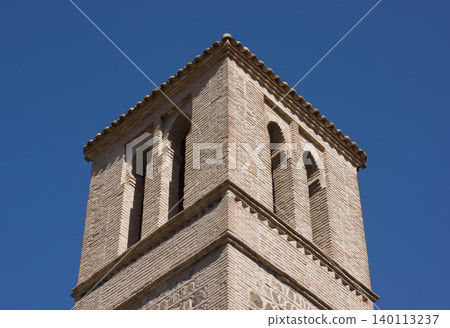 Islamic art style tower top made of bricks or masonry with horseshoe archs 140113237