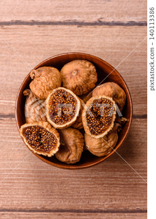 Dried whole fig as an ingredient for sweet desserts. Dried figs Dried whole fig as an ingredient for sweet desserts. Dried figs 140113386