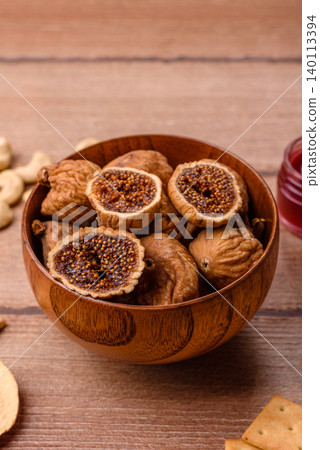 Dried whole fig as an ingredient for sweet desserts. Dried figs Dried whole fig as an ingredient for sweet desserts. Dried figs 140113394