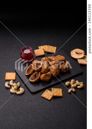 Dried whole fig as an ingredient for sweet desserts. Dried figs Dried whole fig as an ingredient for sweet desserts. Dried figs 140113399
