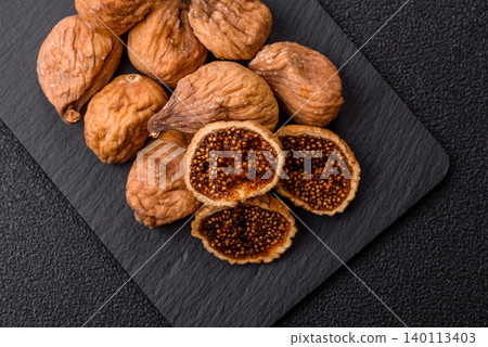 Dried whole fig as an ingredient for sweet desserts. Dried figs Dried whole fig as an ingredient for sweet desserts. Dried figs 140113403