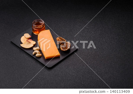 Hard yellow cheddar cheese for sandwiches or pasta. Cheddar cheese Hard yellow cheddar cheese for sandwiches or pasta. Cheddar cheese 140113409