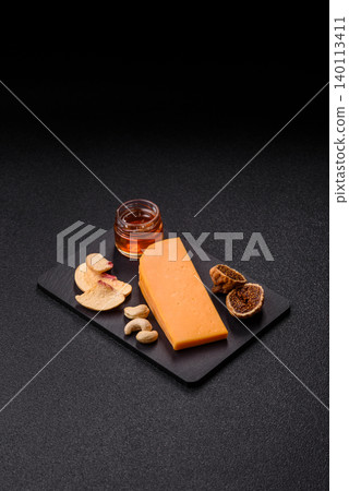 Hard yellow cheddar cheese for sandwiches or pasta. Cheddar cheese Hard yellow cheddar cheese for sandwiches or pasta. Cheddar cheese 140113411