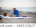 Senior couple in love having romantic picnic on beach by sea. 140113627