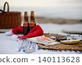 Beach picnic with schripms, beer, fruit and candles 140113628